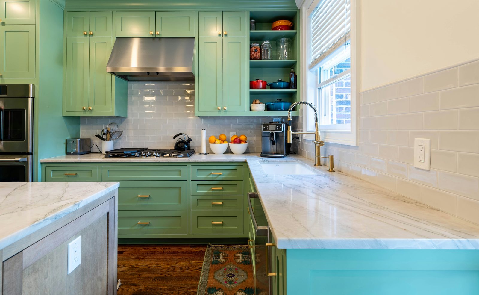 Freshly painted kitchen with sage green cabinets